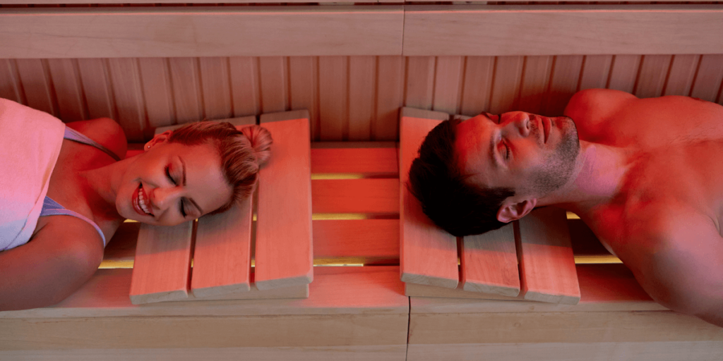 A couple relaxing in a sauna.